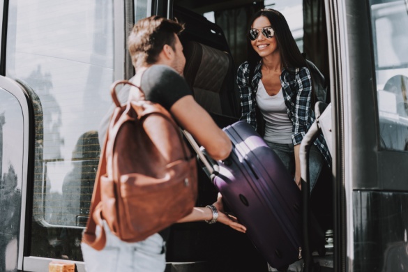 passengers happily boarding a bus